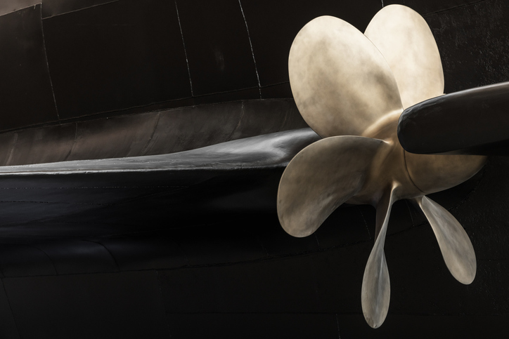 Ship Propeller Close-Up with Black Submarine Boat Hull Background